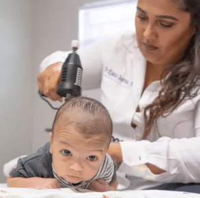 Dr. Olivia D’Acunto providing treatment for an infant at Spring Hill Medical Injury Center: 247 Chiropractic Wellness and Rehab
